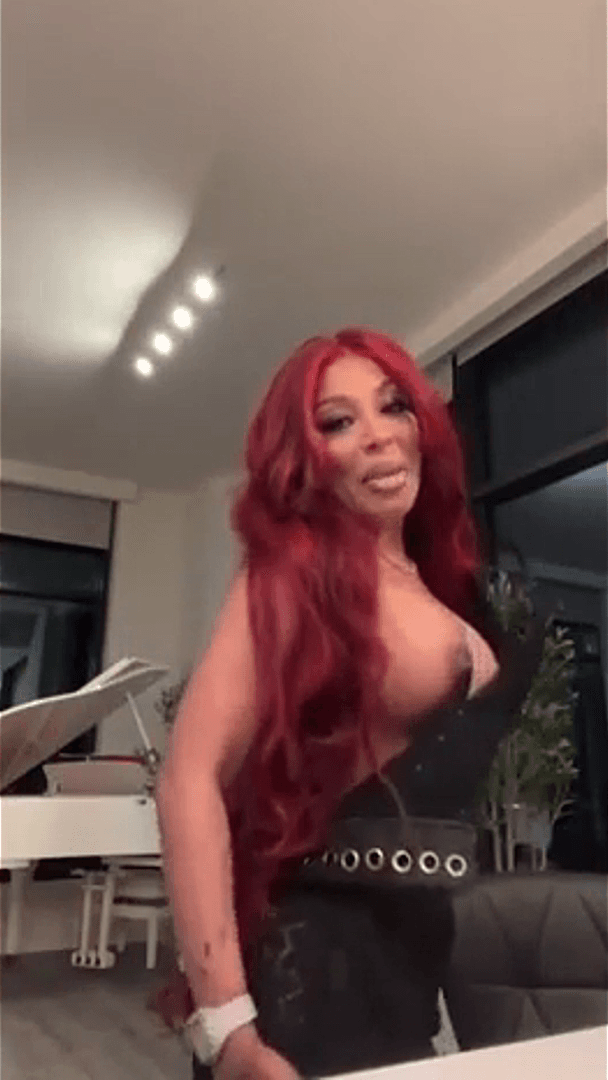 Click to view full size Busty Singer K. Michelle Nipple Slip ?