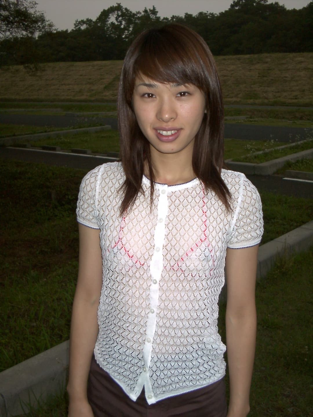 She is wearing see-through underwear and her pubic hair is visible.(Taken on May 22, 2001)