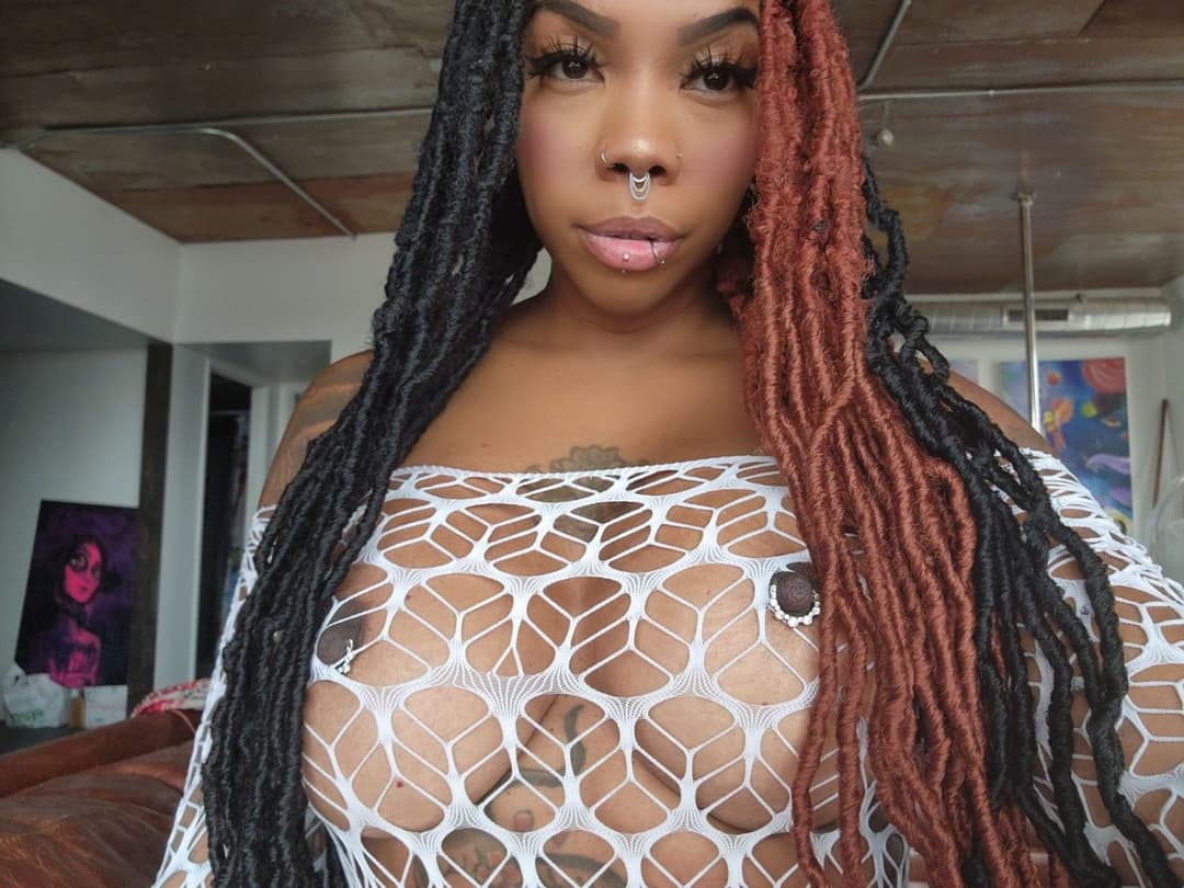 Sexy hot ebony with phat pierced Coochie in withe mesh fishnet bodysuit ??