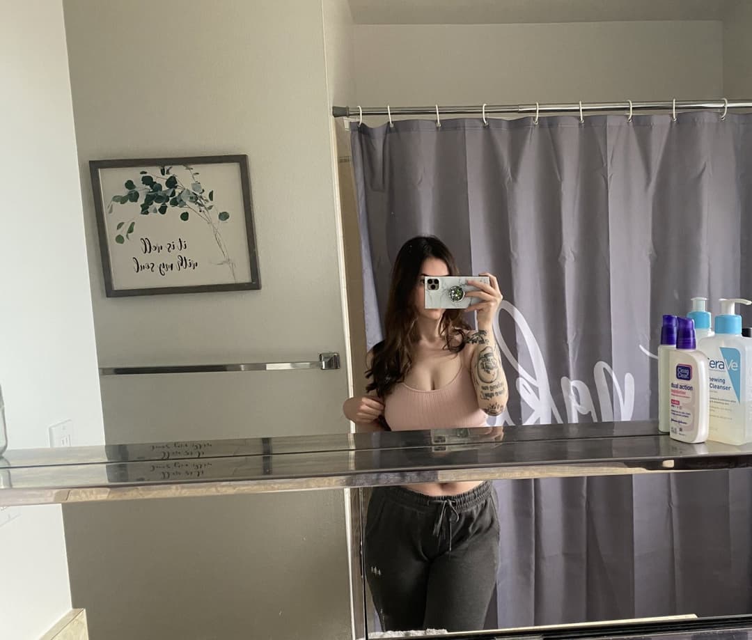 Click to view full size Hottest Milf ever? This curvy slut who loves sticking her tongue out comes damn close