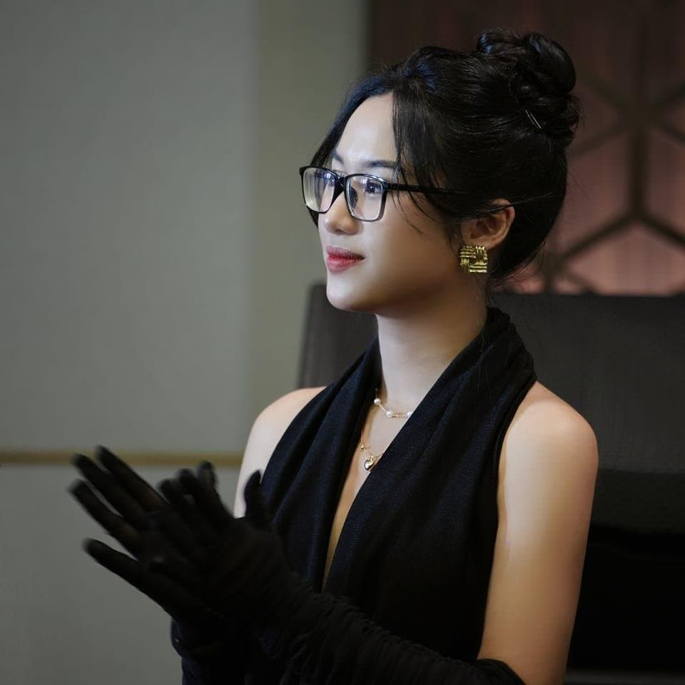 Asian secretary working overtime with her boss at night