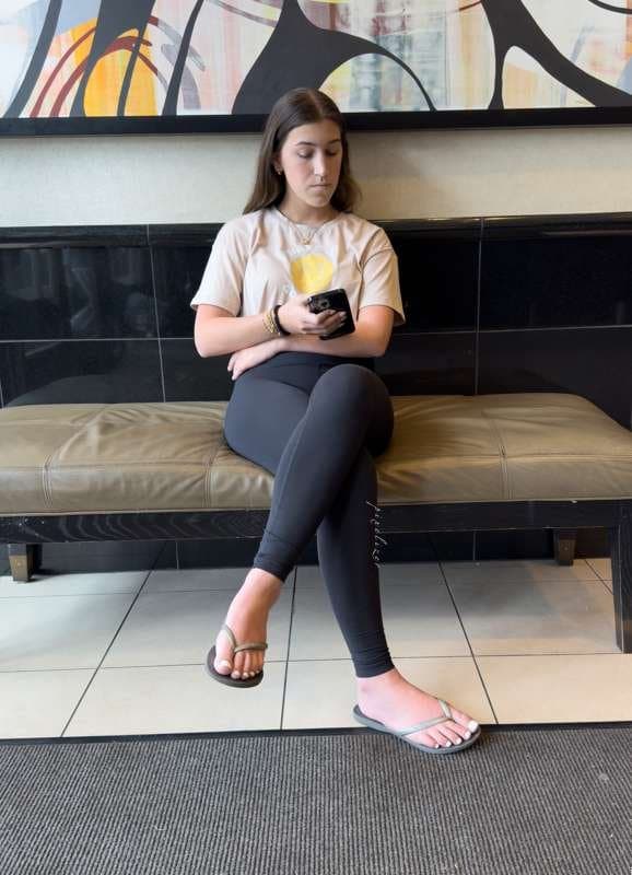 Brunette with white toes and black leggings creepshot