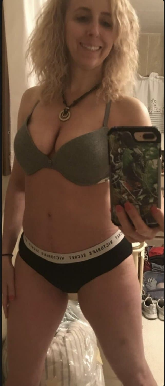 Blonde milfy slut showing off her panties and bra