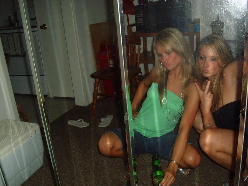 Sorority girls pre-game drink in the dorm room