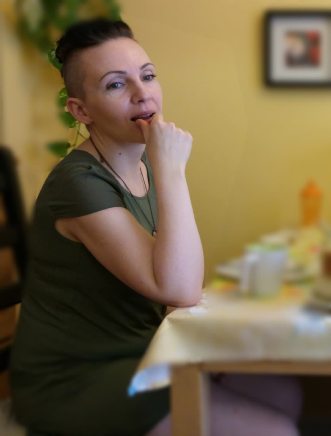 Click to view full size Very pretty MILF spreads her legs on the sofa.