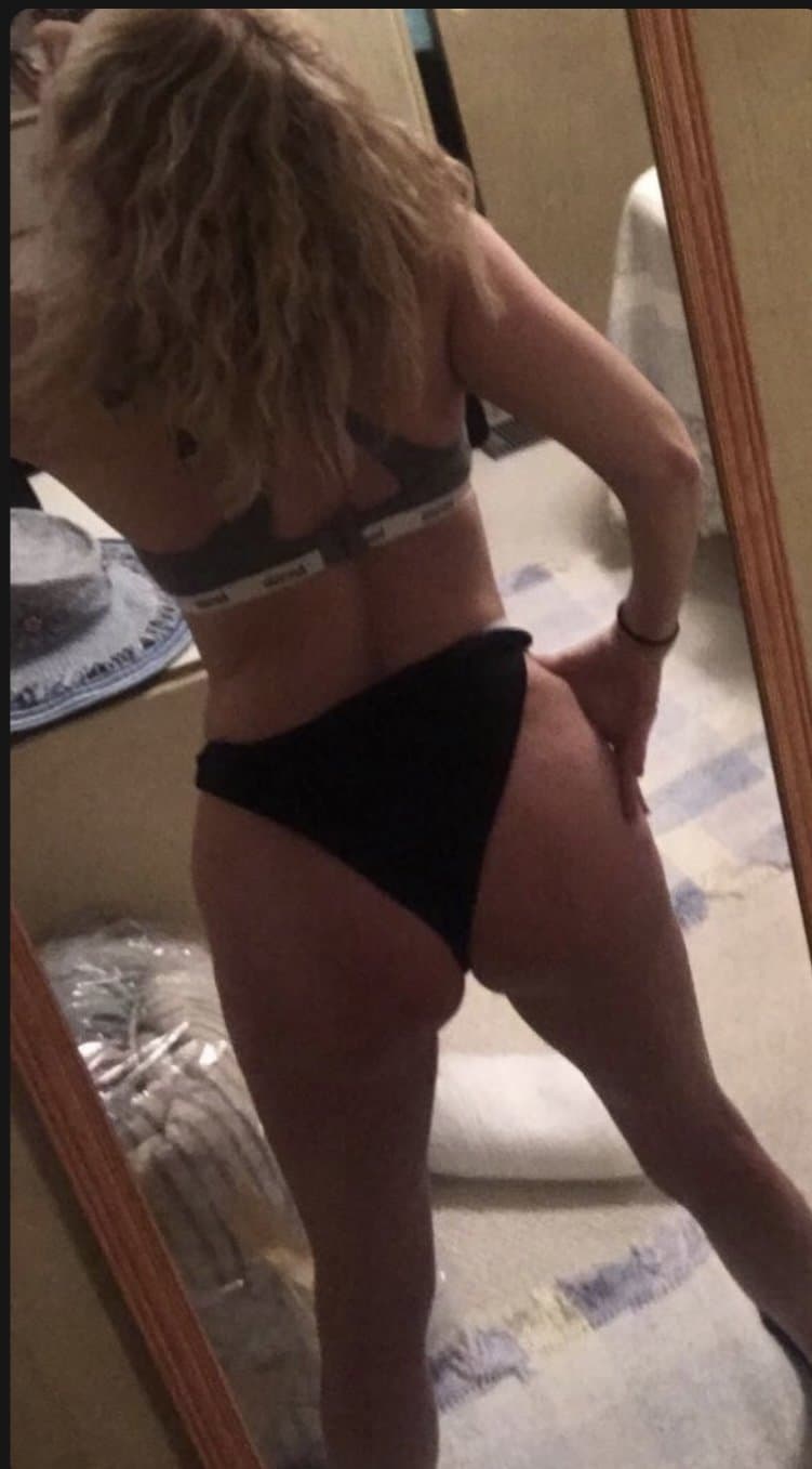 Blonde milfy slut showing off her panties and bra