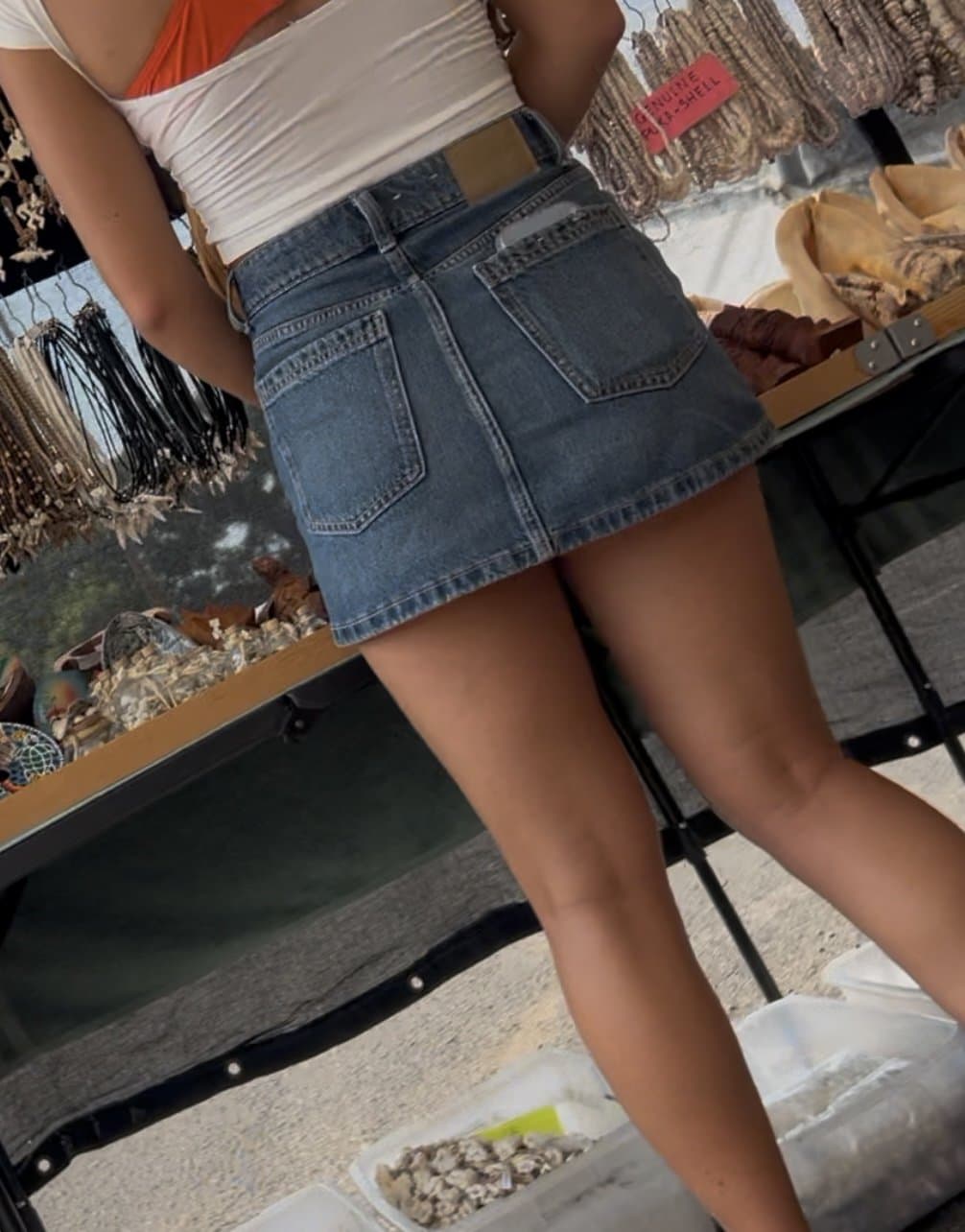 Sexy tan legs in skirt