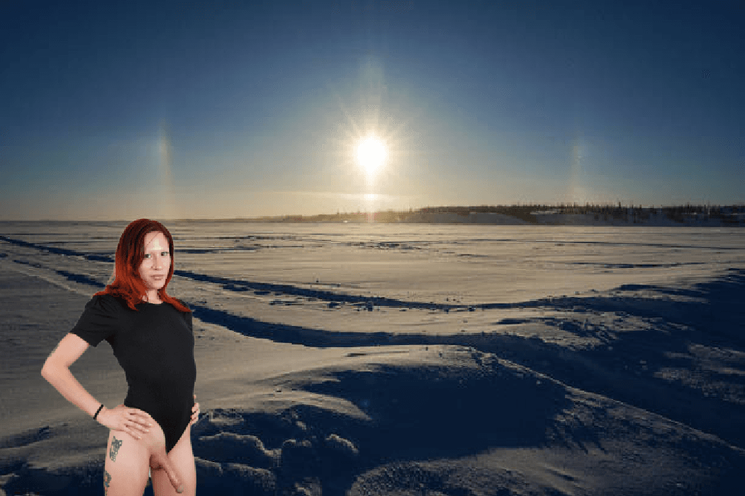 Red Haired Transwoman Drewcilla Under A Sun Halo Over Yellowknife Bay On Great Slave Lake