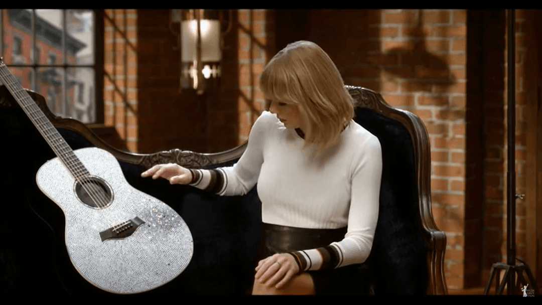 Taylor Swift tight white sweater, leather skirt, leather heels