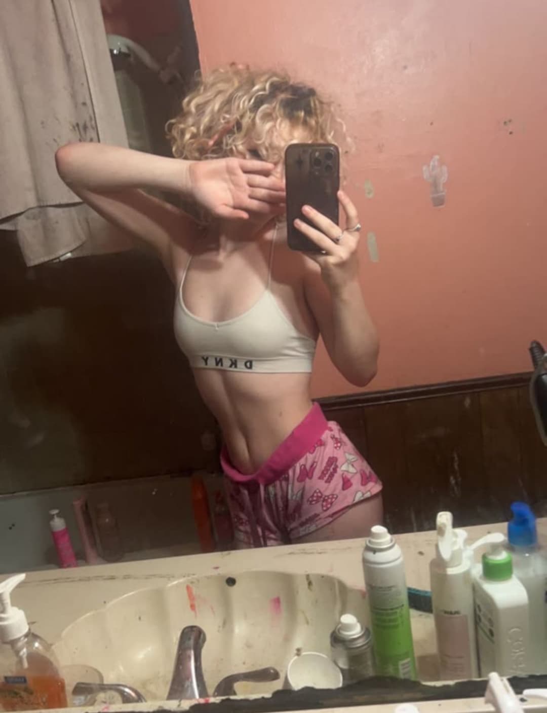 pink haired emo girl arches and shows ass