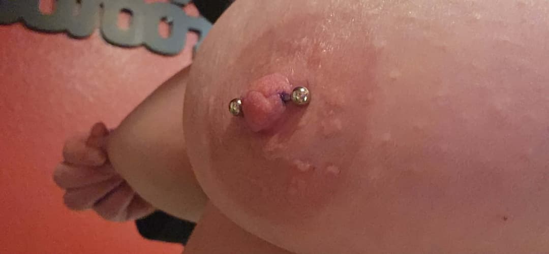 Girlfriend showing off new nipple piercing.
