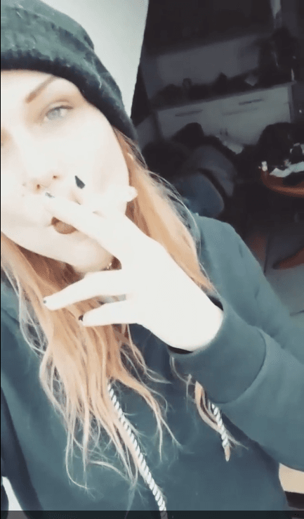 smoking hot emo hipster goth girl fucks the guys in the band. I love when women smile and smoke.