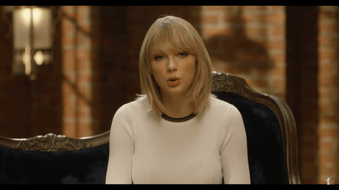 Taylor Swift tight white sweater, leather skirt, leather heels