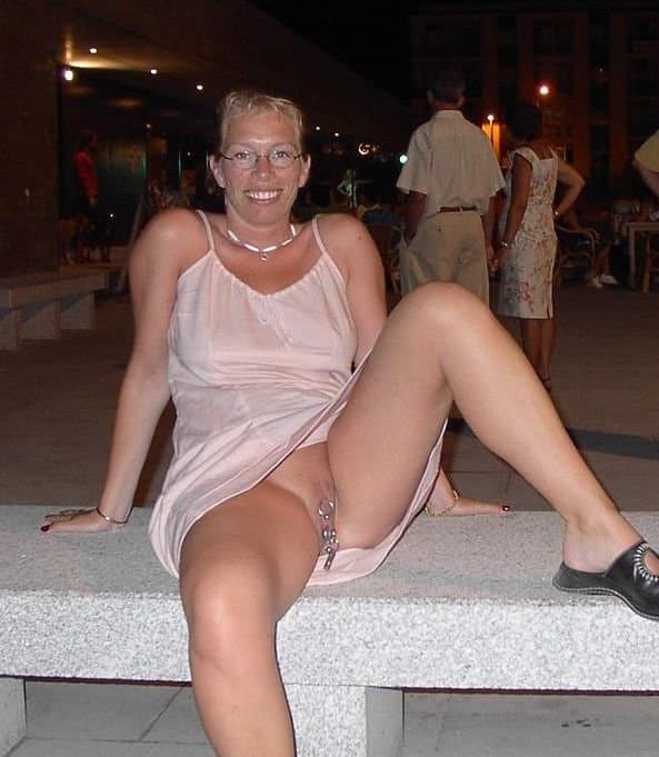 Amateur flasher with cunt piercings