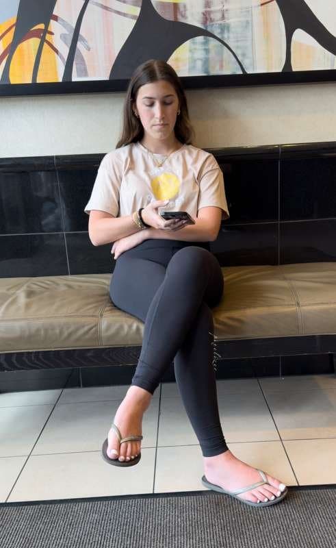 Brunette with white toes and black leggings creepshot