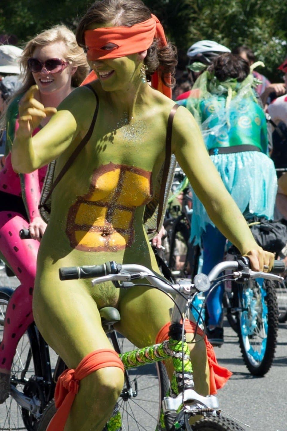 Nudist girls doing body paint in public