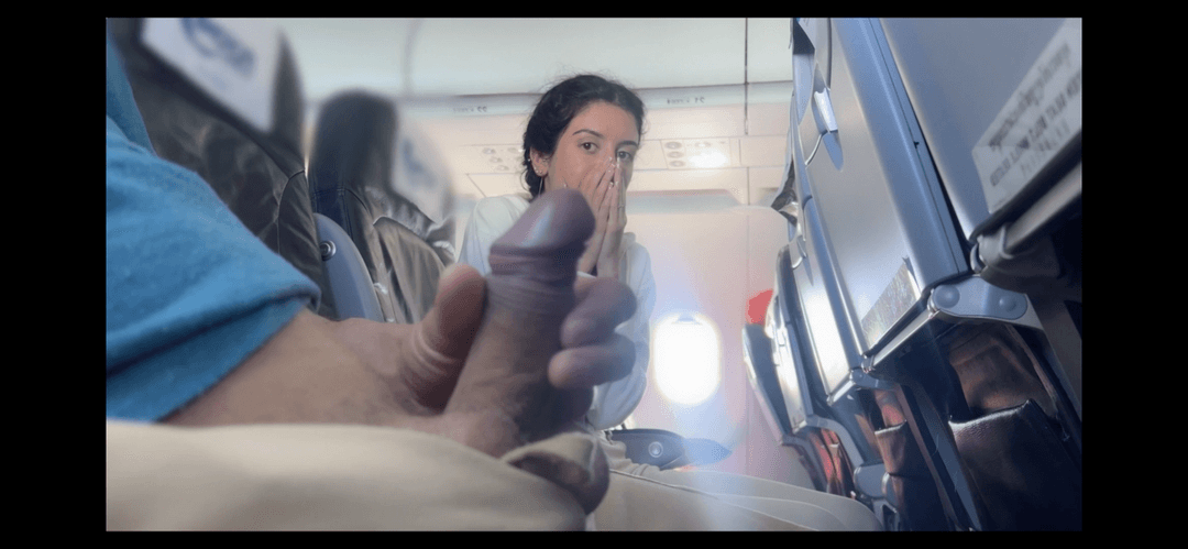 latina is shock by the dick and gives a handjob in the airplane