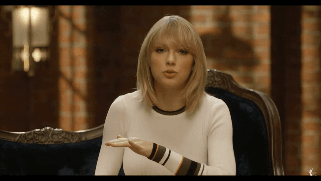 Taylor Swift tight white sweater, leather skirt, leather heels