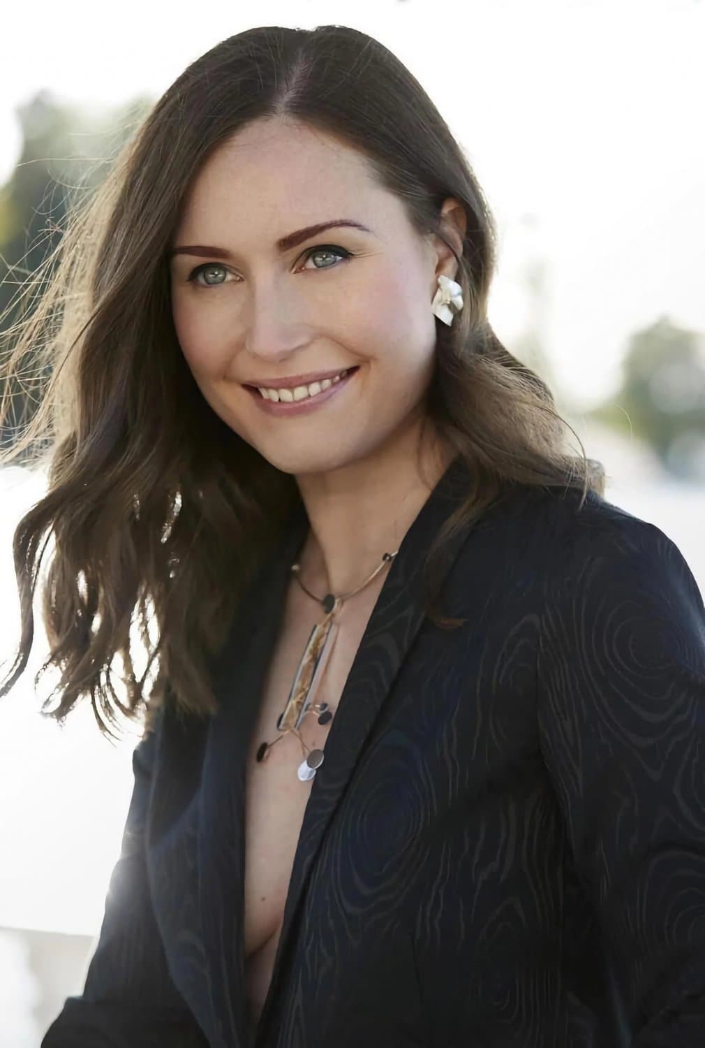 Finnish prime minister Sanna Marin.  Petite Elegant lady hinding a sex freak party chic within
