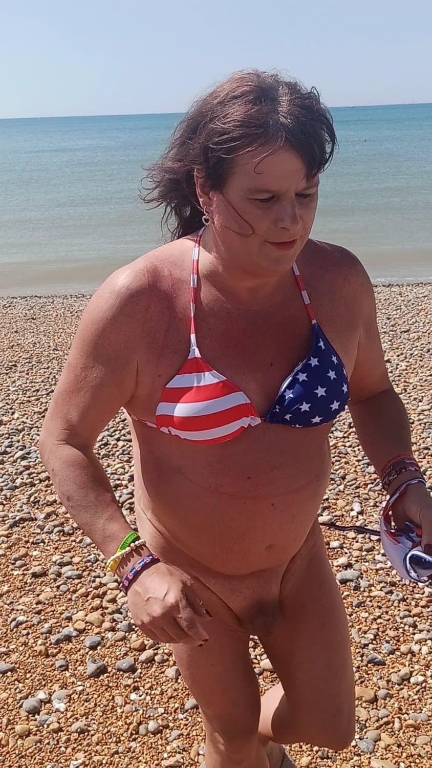 Click to view full size Bottoms off on Brighton nude beach