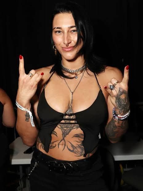 Click to view full size Rhea Ripley takes off top and shows off her boobs - Fake AI Video