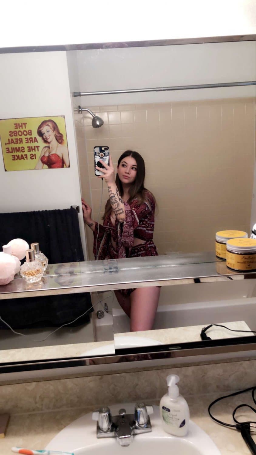 Click to view full size Hottest Milf ever? This curvy slut who loves sticking her tongue out comes damn close