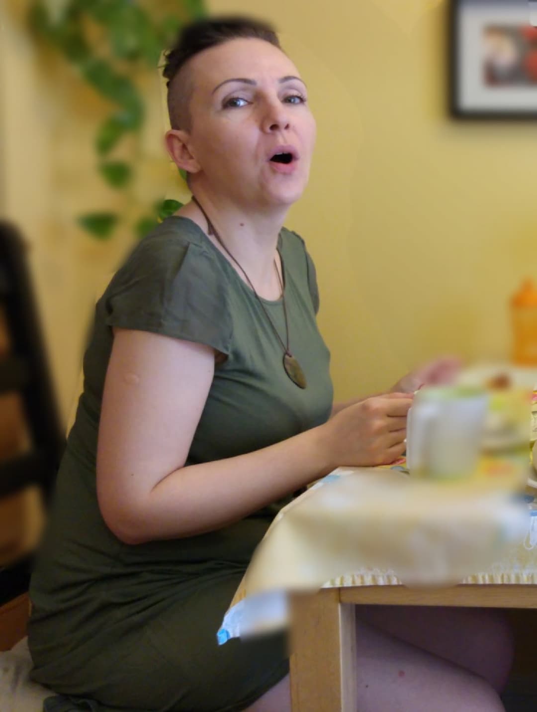 Click to view full size Very pretty MILF spreads her legs on the sofa.