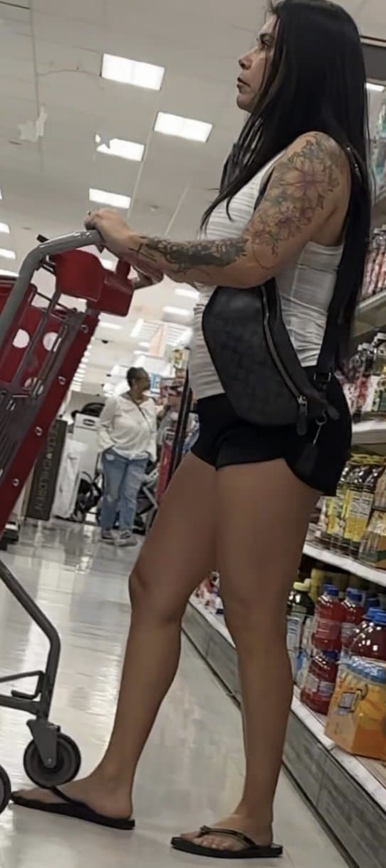 Click to view full size Latina, booty shorts, flip flops, bending over