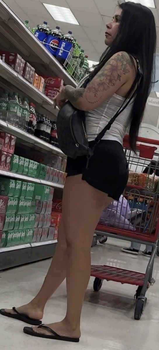 Click to view full size Latina, booty shorts, flip flops, bending over