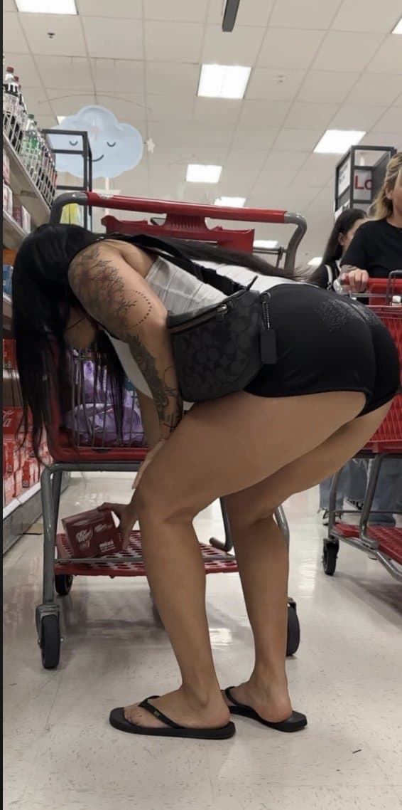 Click to view full size Latina, booty shorts, flip flops, bending over
