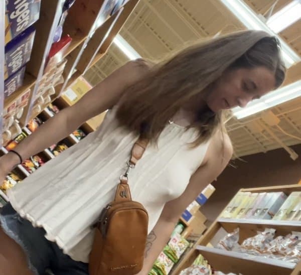 Click to view full size Bitch with no bra and big floppy tits at the store creep shots